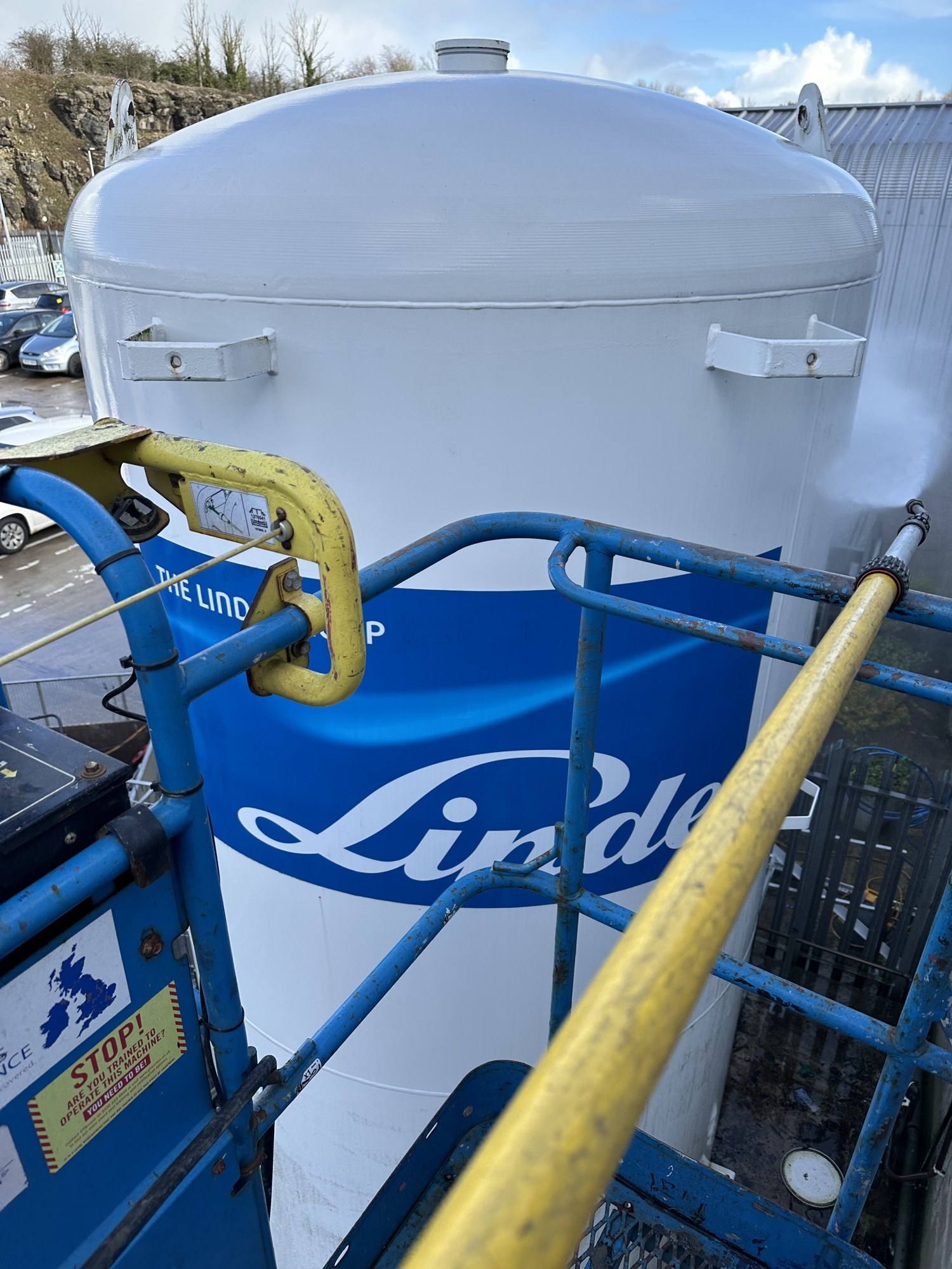 Pressure washing a large industrial gas storage tank